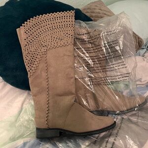 Women’s size 7 boots by Reba; never worn still in plastic